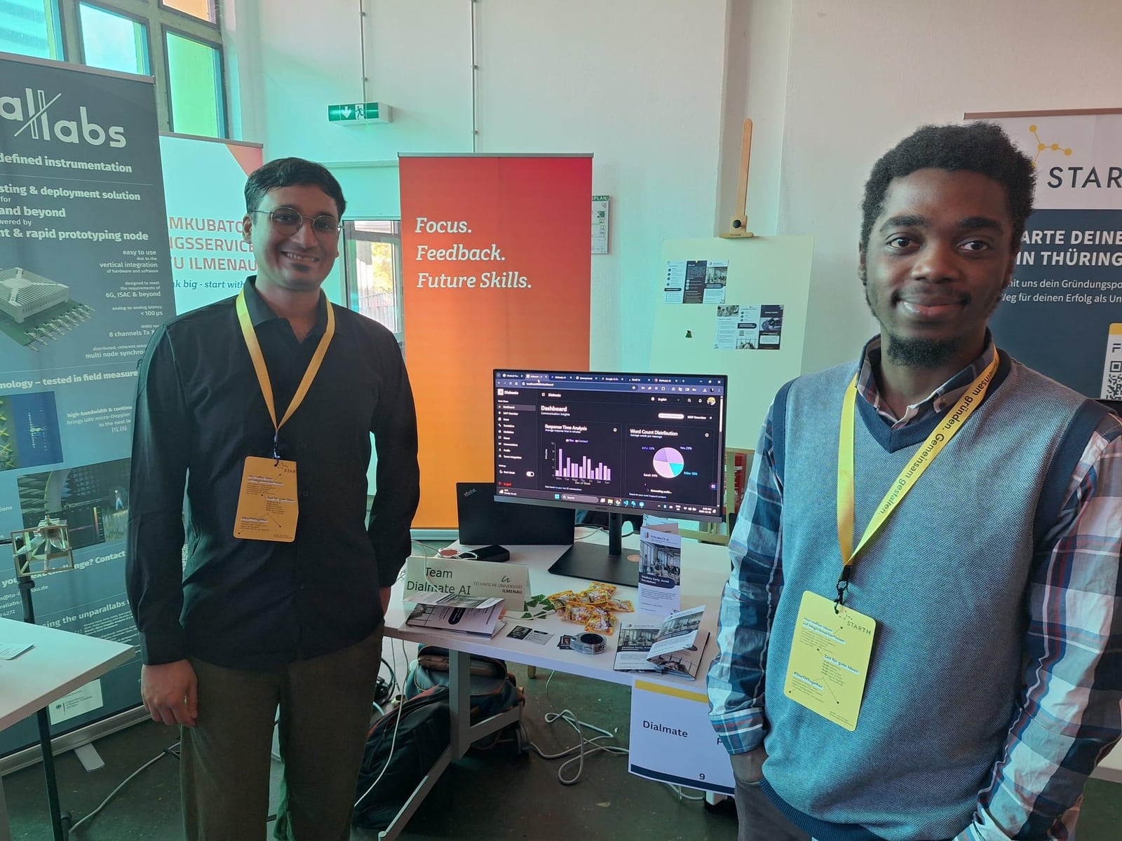 Aurel Nzeyap presenting the Dialmate AI demo booth at a TU Ilmenau startup fair